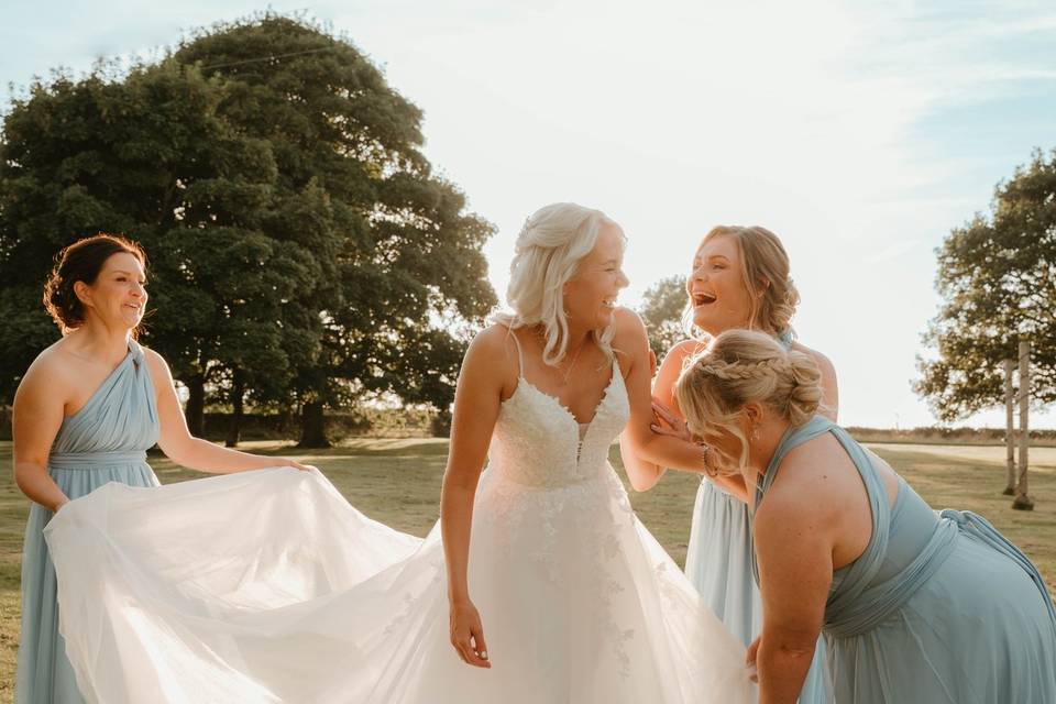 Bridesmaid laughs