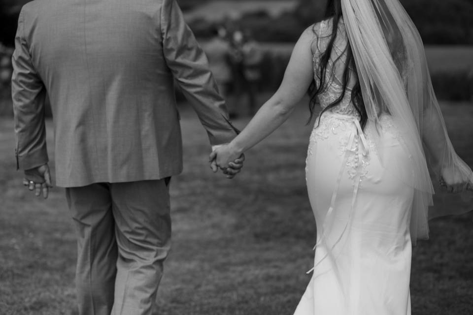 Bride and Groom Hold Hands
