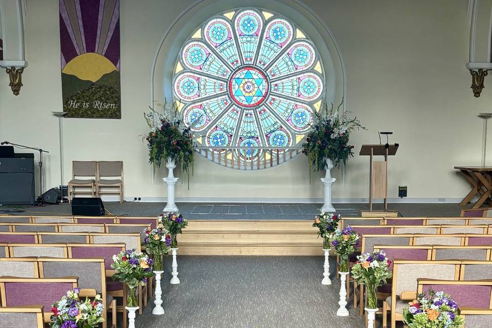 Aisle flowers and pedestals