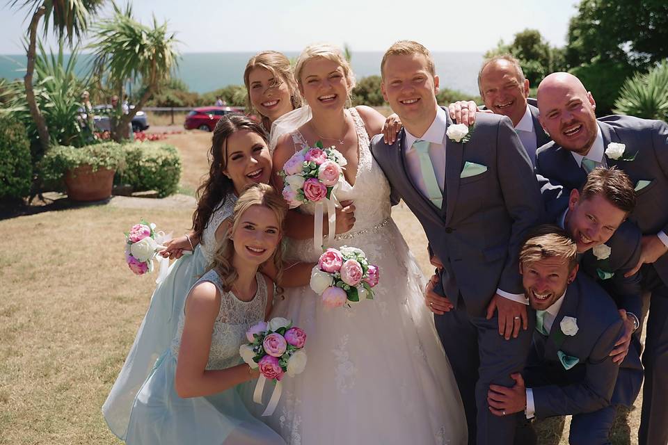 Bridesmaids and groomsmen pose