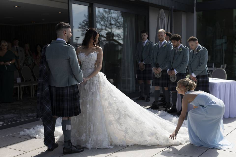 Helping to fix dress