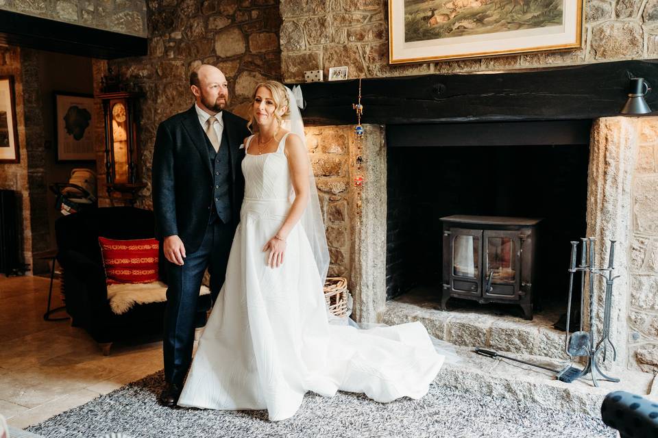 Bride and groom fireplace