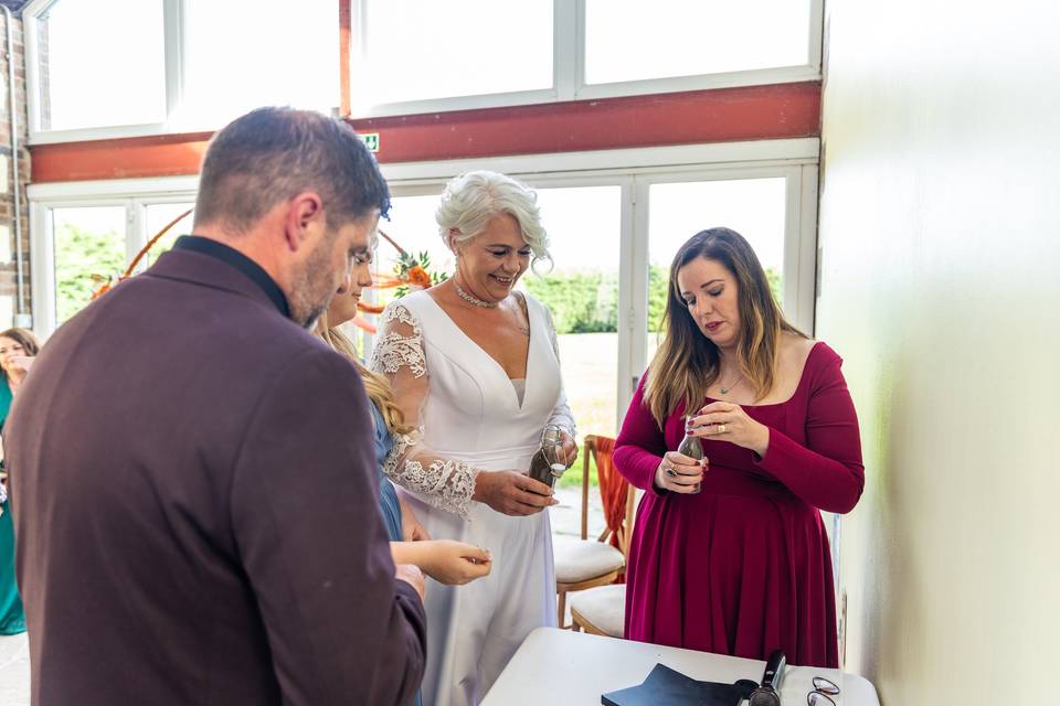 guests gathered around wedding couple