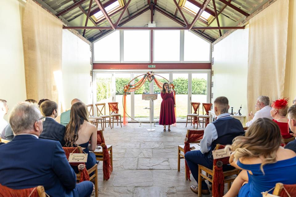wedding guests seated watching ceremony