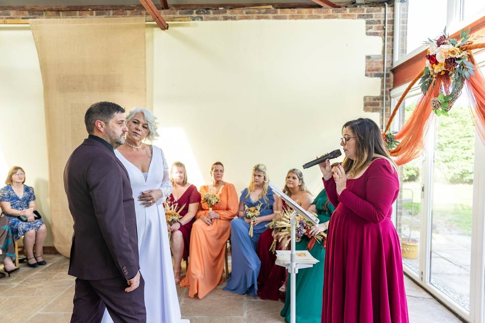 wedding party standing at altar