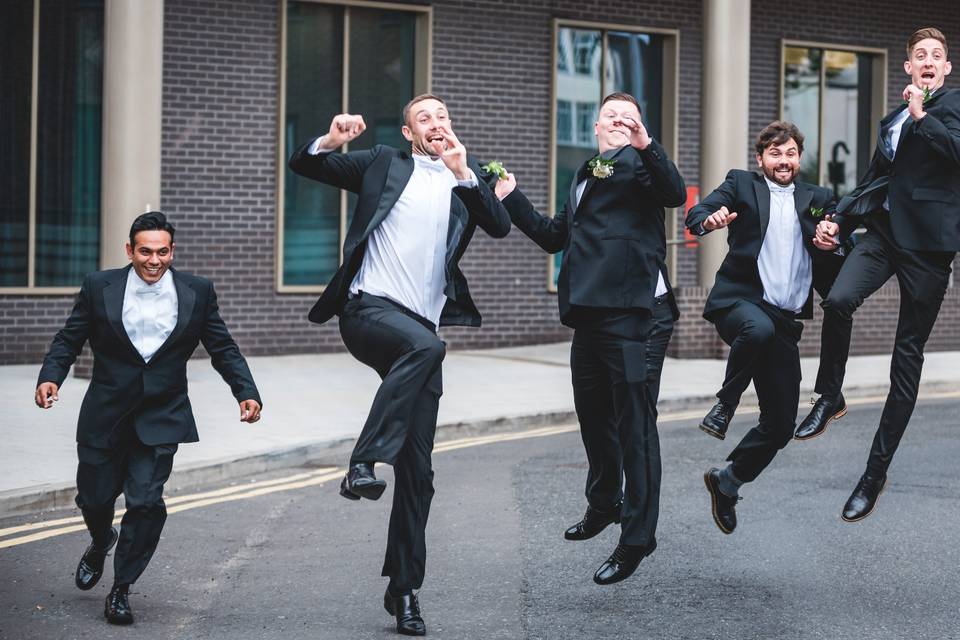 Wedding party jumping