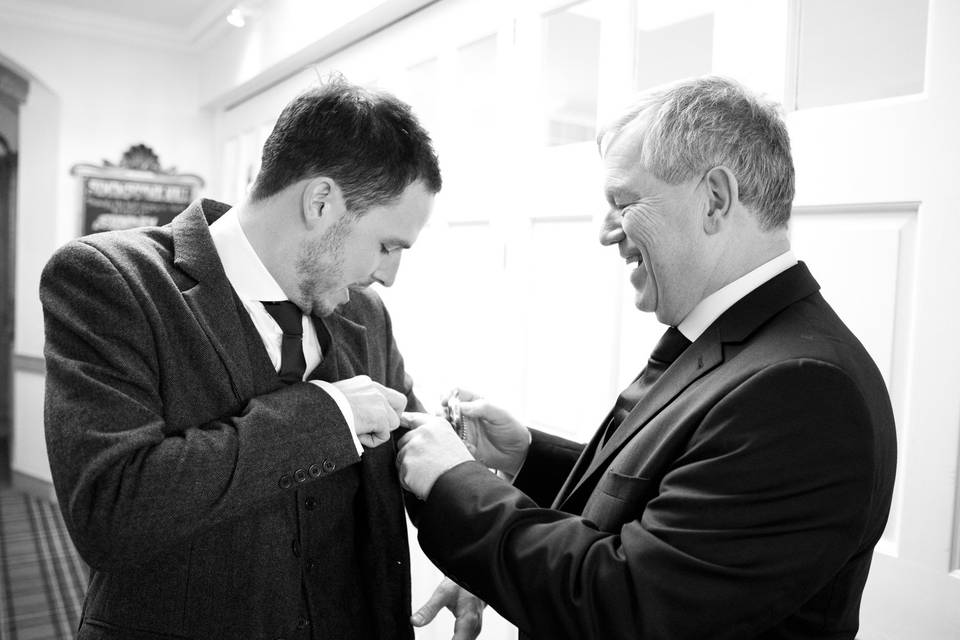Helping to attach the buttonhole!