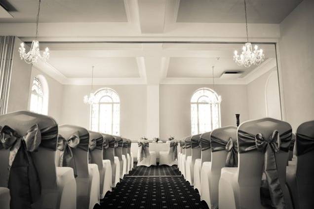 Ceremony room with stained glass windows and chandeliers