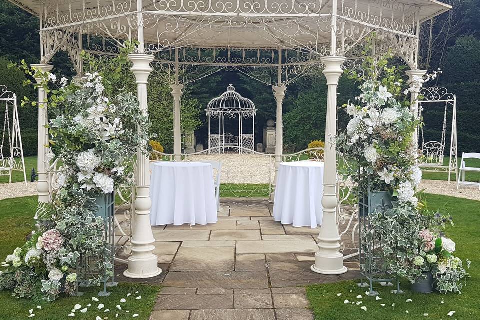 Hire faux floral arch pillars