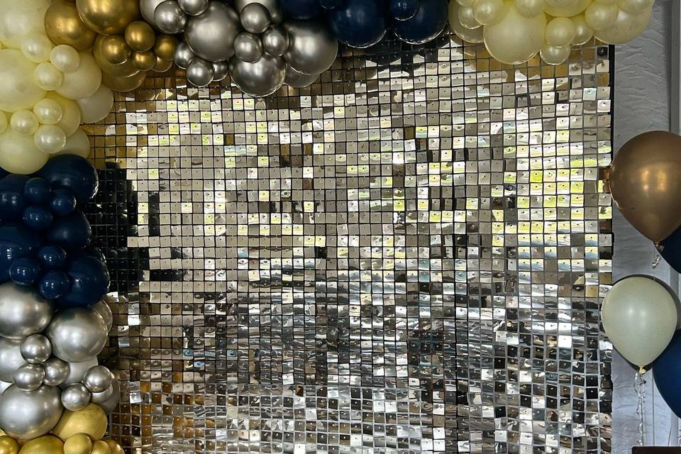 Sequin wall and balloon arch.