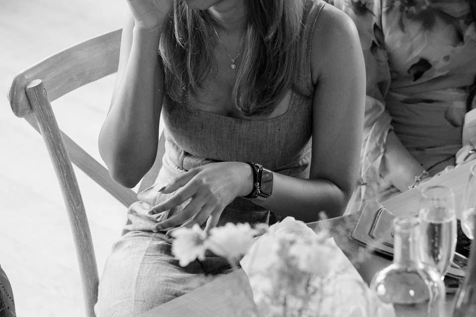 Wedding guest wiping a tear