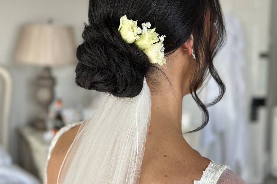 Low bun with fresh flowers