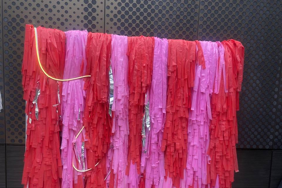 Pink and red streamer wall