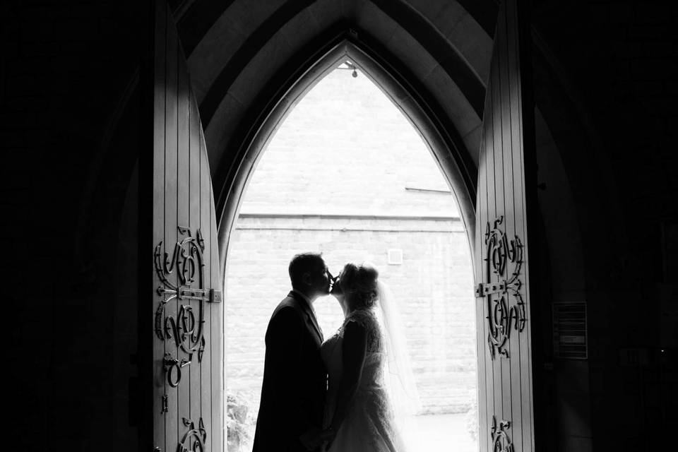 Bride and groom kissing