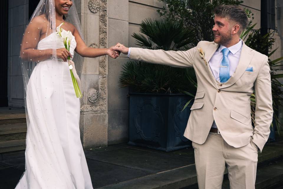 Groom leading his new bride