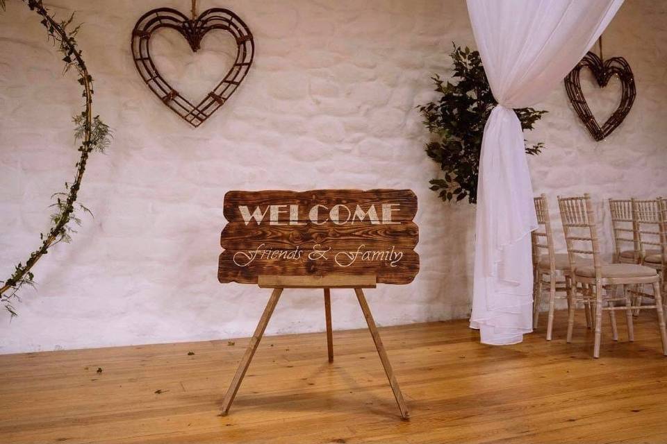 Rustic welcome sign and easel