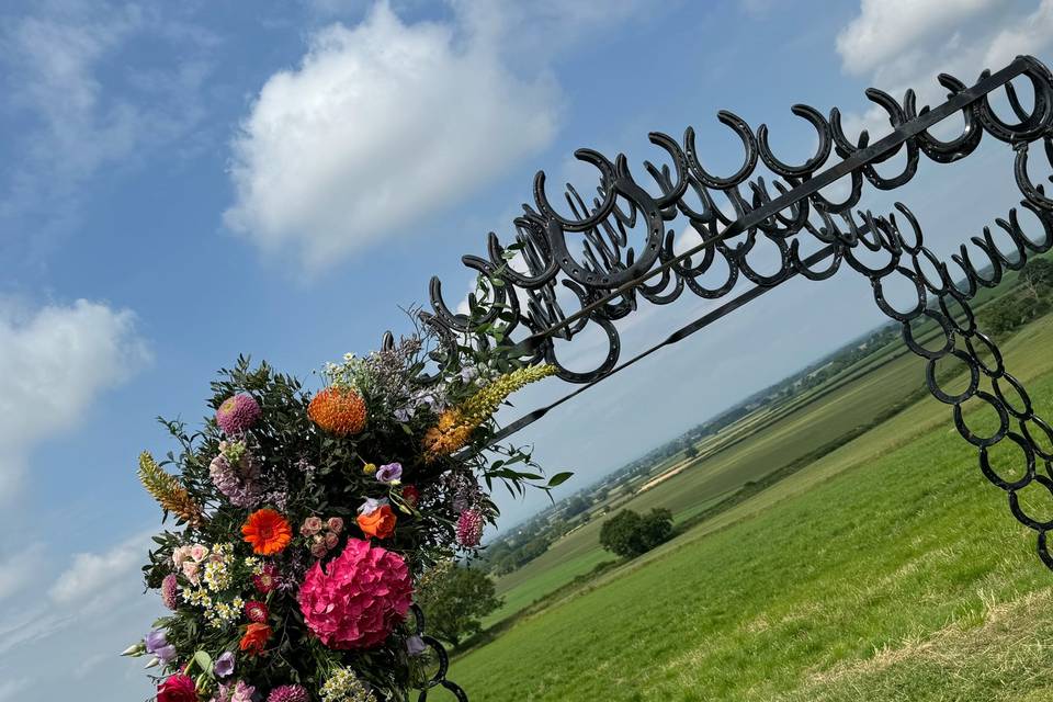 Flowers attached to arch