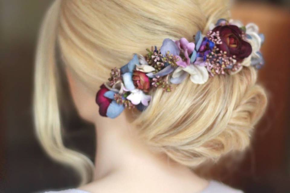 Low chignon with flower crown