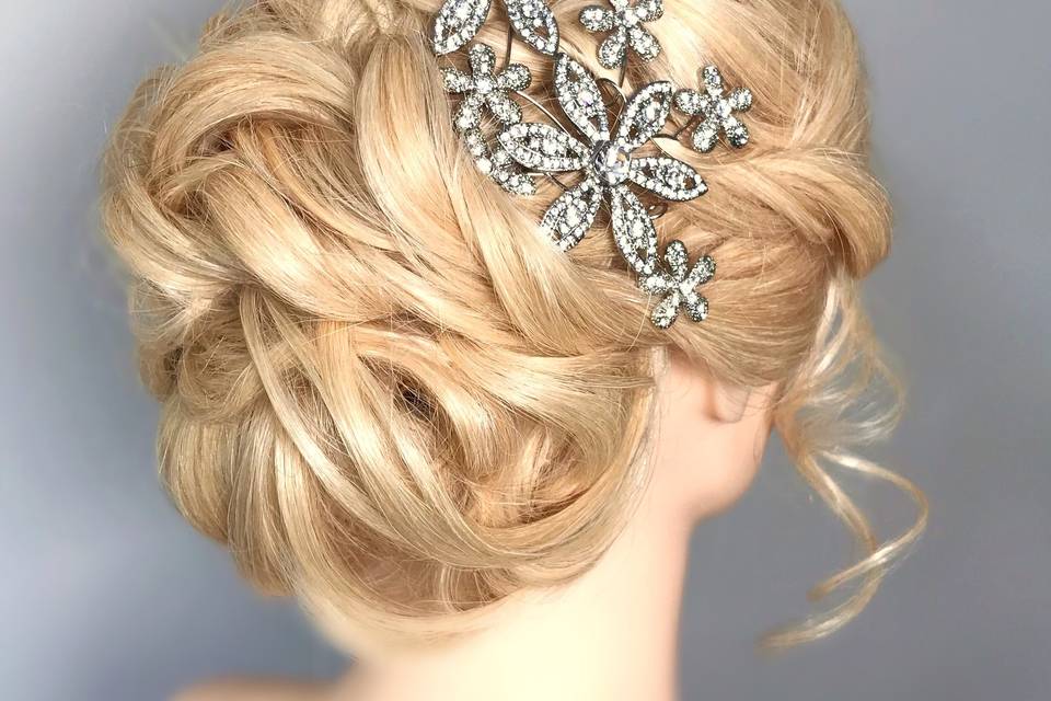 Low chignon with flower crown