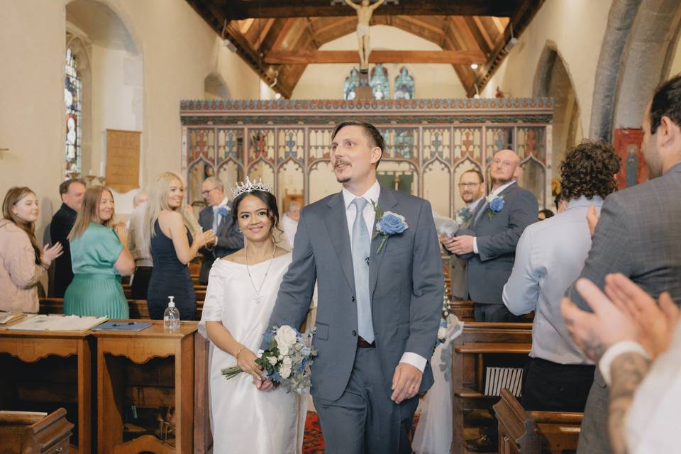 Couple leaving church w/ claps
