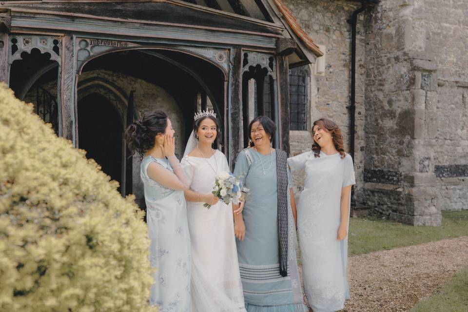 Bride, mum and sisters outside