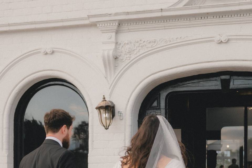 Couple walking into reception