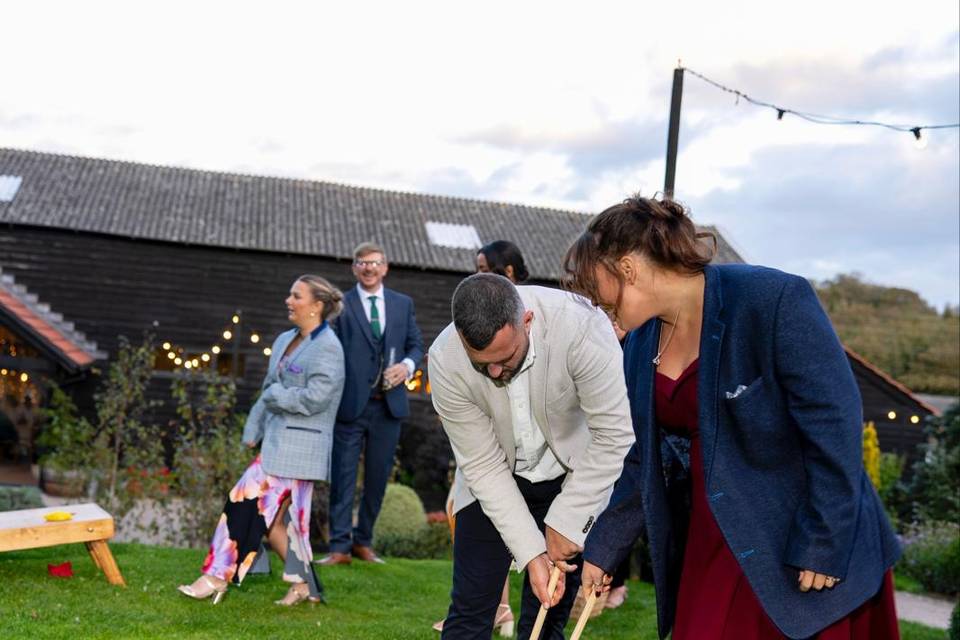 Guests playing croquet