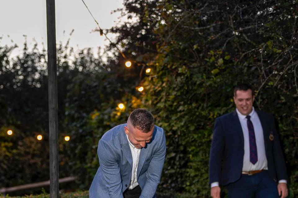 Guests playing croquet