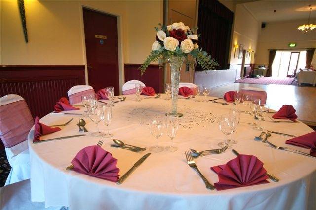 Place settings and floral centrepiece