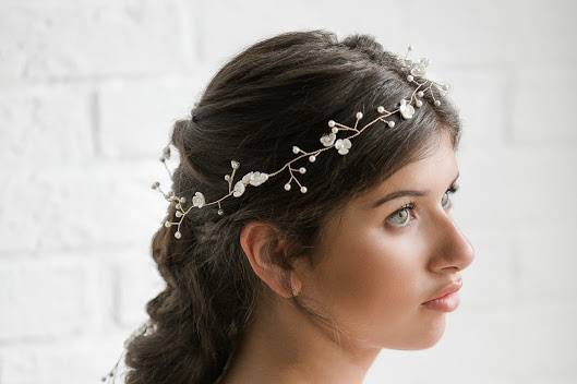 Wedding braid with floral hairpiece