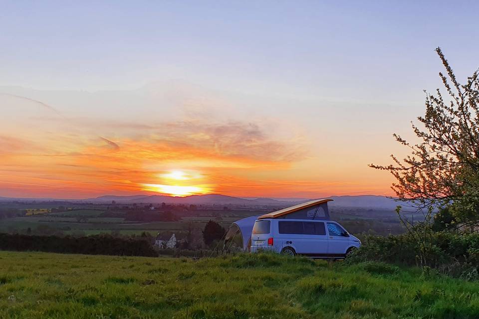 Camper van at sunset