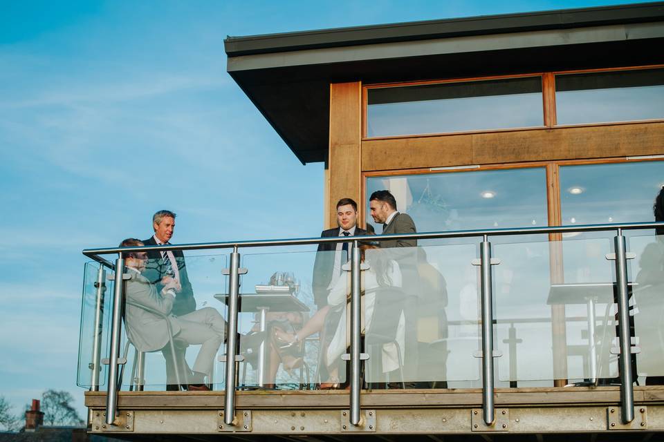 Guests relax on balcony