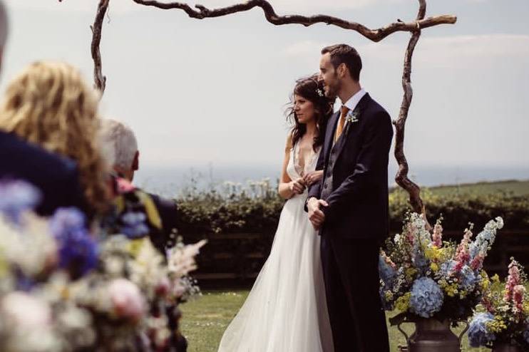 Ceremony aisle and milk churns