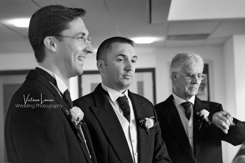 Nervous groom, happy best man