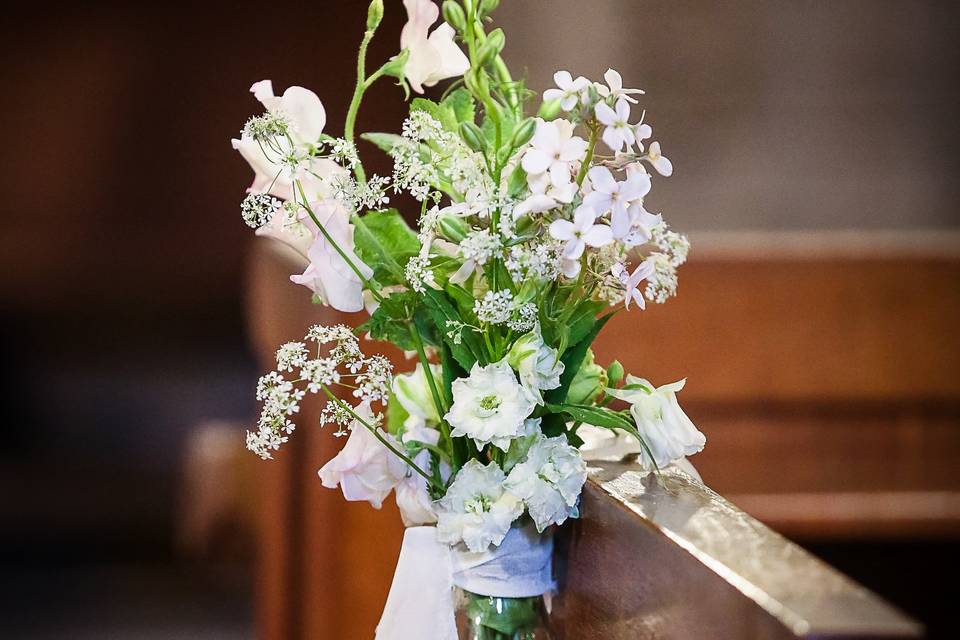 Pew ends in milk bottles