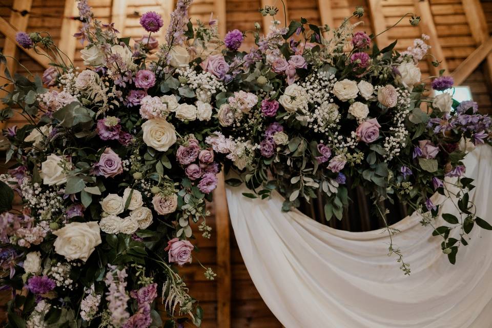 Wooden wedding arch florals