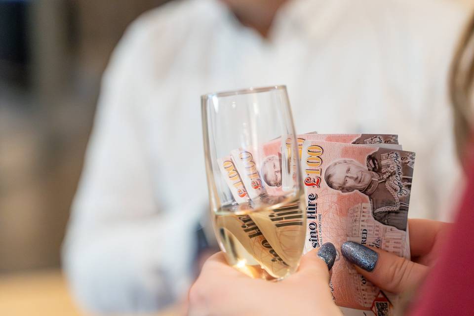 Fun money and champagne flute