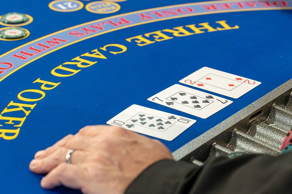 Three card poker reveal