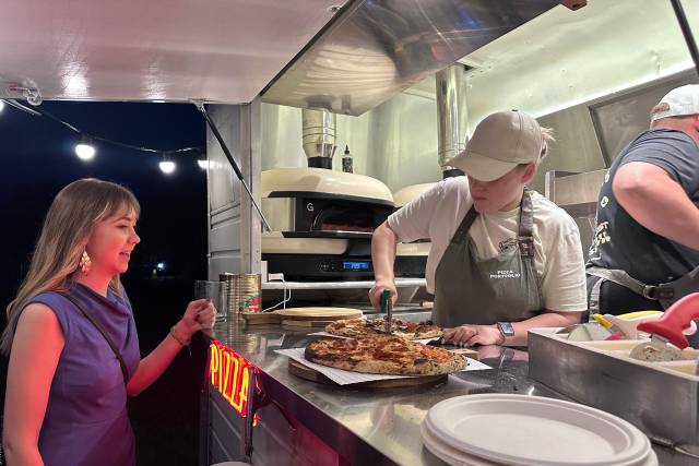 Hannah serving a hungry guest