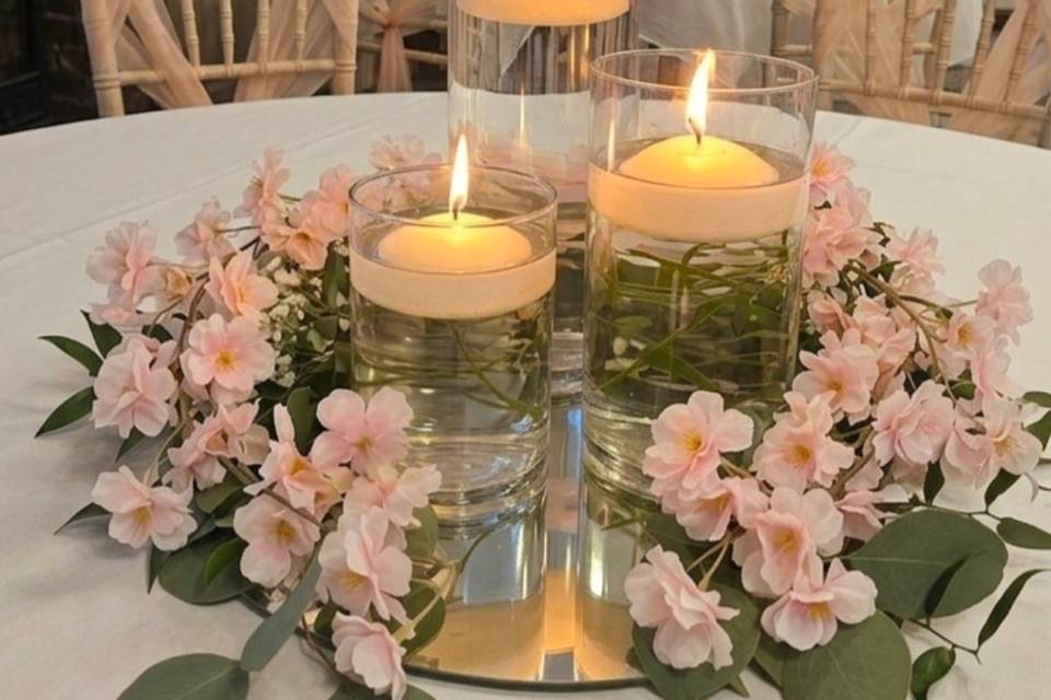 Hurricane vases and floral gar