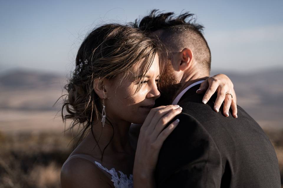 Bride and groom hug