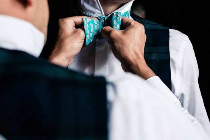 Tying a bow tie for the weddin