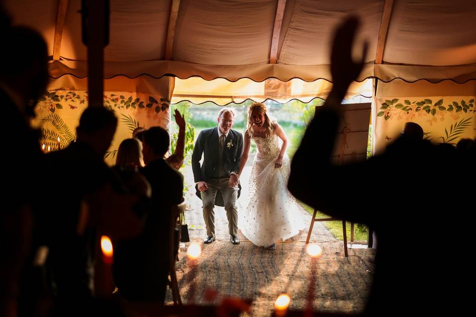 Newlyweds entering the marquee
