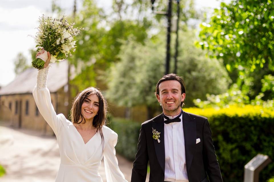 Bride & groom smiling @ camera