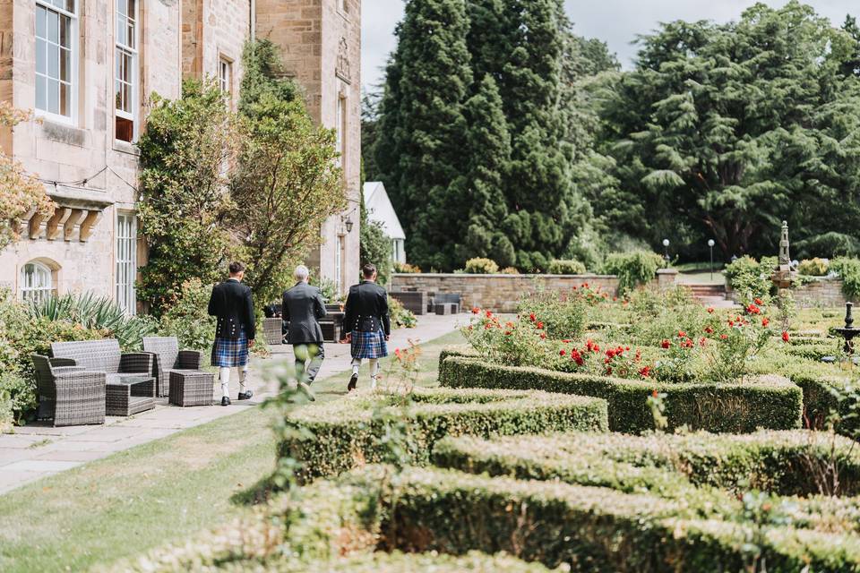 Groomsmen in garden