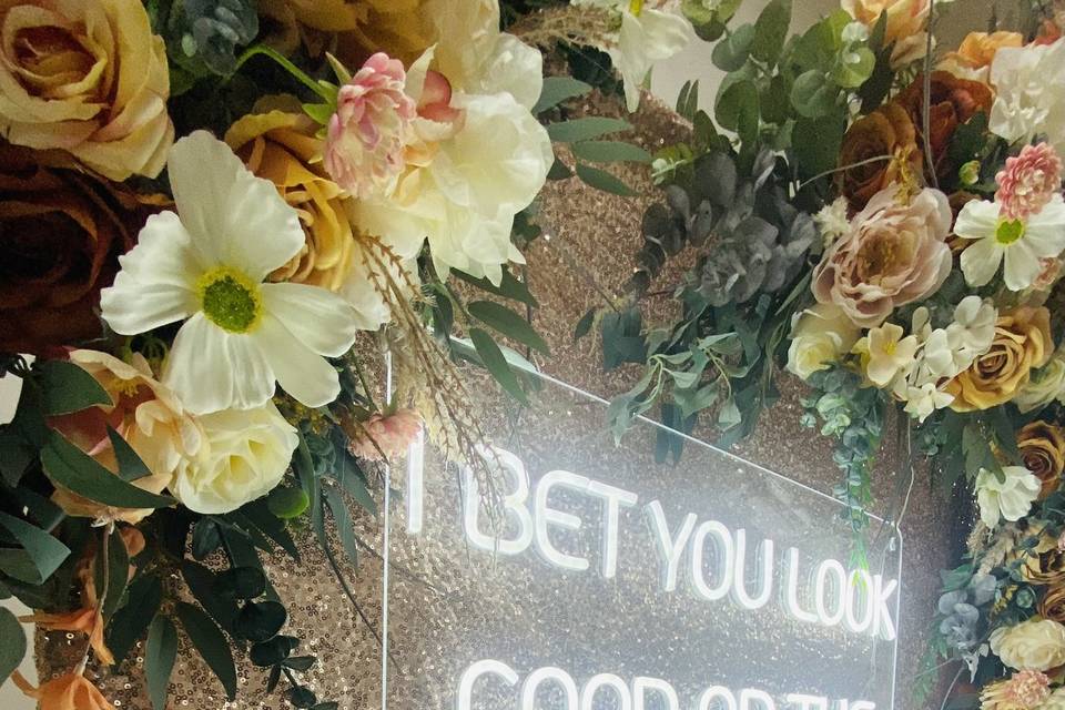 Neon sign and flower backdrop