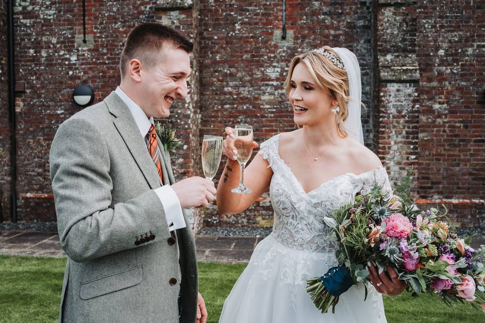 Bride and groom cheering