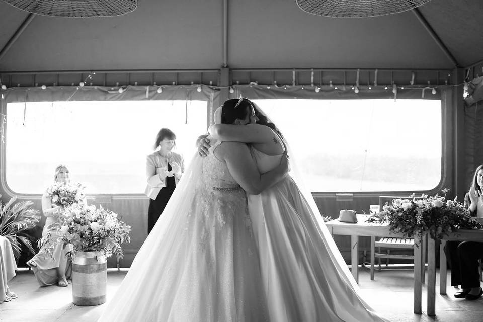 Brides hugging