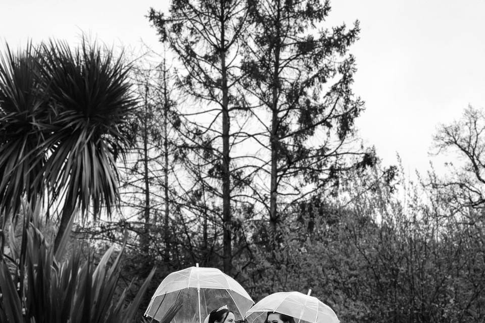 Couple portrait rainy garden