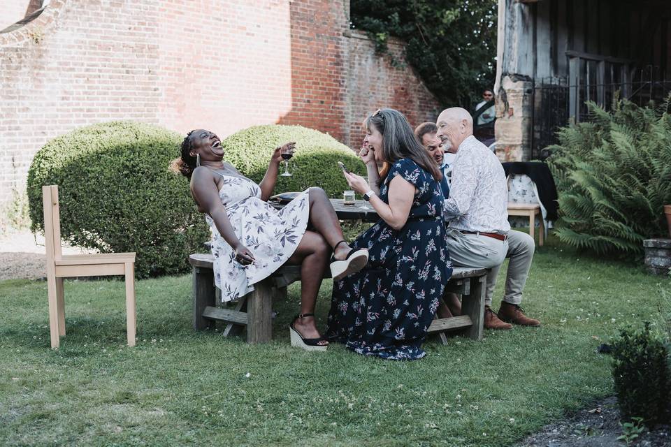 Guests laughing Lewes wedding